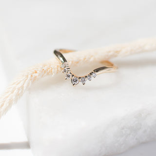 Sahara Diamond v shaped band with stock on marble quarter view