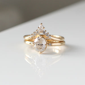 Golden Crown Pear and Round Diamond Ring stacked with oval diamond ring quarter view
