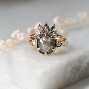 Sunrise Diamond Crown Band stacked with salt and pepper diamond ring on marble