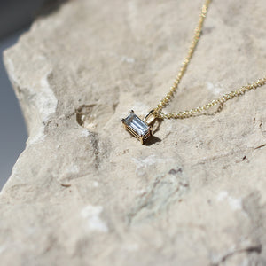 White Sapphire Baguette Necklace on stone in light