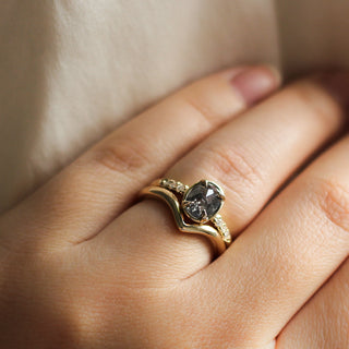 Rose cut oval diamond ring paired with gold stacking band on hand
