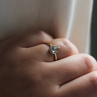Pear diamond ring in yellow gold on hand
