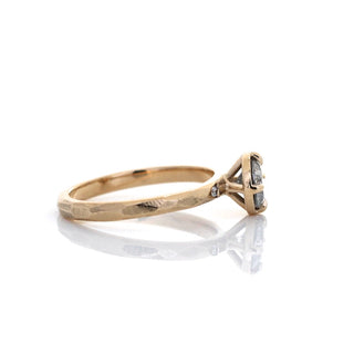 Oval brilliant cut diamond ring side view with reflection