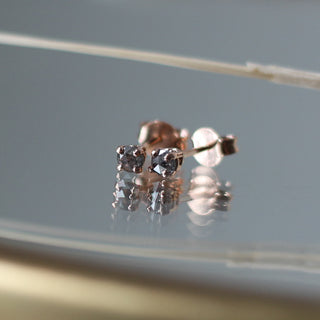 Salt & Pepper Diamond Studs in rose gold on mirror