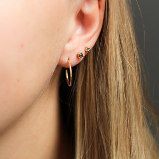 Salt & Pepper Diamond Studs paired with small diamond studs and thin hoops on ear