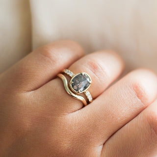Wave Band in Yellow Gold stacked with oval diamond ring on hand